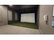 Home theater space with a projector screen and tiered seating at 1643 Wimberly Rd, Apex, NC 27523