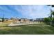 Exterior shot of a sand volleyball court, and community pool with surrounding residential buildings in the background at 1643 Wimberly Rd, Apex, NC 27523