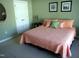 Bedroom with a bed, art, mirror and closet at 2002 Clyde Bank Ct, Cary, NC 27511