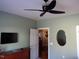Bedroom featuring a ceiling fan, TV, and doorway at 2002 Clyde Bank Ct, Cary, NC 27511