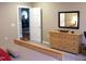 Bedroom featuring a dresser, carpeted floor and door leading into another room at 2002 Clyde Bank Ct, Cary, NC 27511