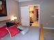 Bedroom with en-suite bathroom featuring a large bed, soft carpet, and door to the bathroom at 2002 Clyde Bank Ct, Cary, NC 27511