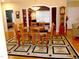 Dining room featuring hard wood floors, seating for six, and an ornate rug at 2002 Clyde Bank Ct, Cary, NC 27511