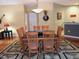 Bright dining room features a modern light fixture and a sleek table with seating for eight at 2002 Clyde Bank Ct, Cary, NC 27511