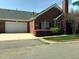 Brick home with two car garage and lush landscaping at 2002 Clyde Bank Ct, Cary, NC 27511