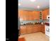 Functional kitchen offering wood cabinets, stainless appliances, and lots of counter space at 2002 Clyde Bank Ct, Cary, NC 27511