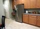 Kitchen area with stainless steel refrigerator, adjacent counters and seating, and white doors at 2002 Clyde Bank Ct, Cary, NC 27511