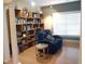 Cozy living room with a comfortable sofa, wooden floors, and built-in shelving units at 2002 Clyde Bank Ct, Cary, NC 27511