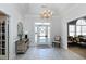 An elegant lobby with a chandelier and console table at 2002 Clyde Bank Ct, Cary, NC 27511