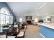 Open concept community area with multiple tables and fireplace at 2002 Clyde Bank Ct, Cary, NC 27511