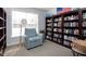 A cozy reading room has a chair and large bookshelves at 2002 Clyde Bank Ct, Cary, NC 27511