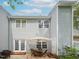 Backyard patio with a table, umbrella, wicker chairs, brick steps, and siding on the building at 2067 White Pond Ct, Apex, NC 27523