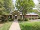 Charming community clubhouse featuring brick facade, green shutters, and lush landscaping at 2067 White Pond Ct, Apex, NC 27523