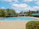 A stunning community pool with ample seating and a clubhouse in the background at 2067 White Pond Ct, Apex, NC 27523