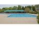 A large, clean community pool with covered seating, perfect for relaxation and recreation at 2067 White Pond Ct, Apex, NC 27523