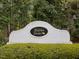 A welcoming stone sign for the Walden Townes community with manicured landscaping at 2067 White Pond Ct, Apex, NC 27523