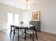 Bright dining area with a modern table and chairs, complemented by natural light at 2067 White Pond Ct, Apex, NC 27523
