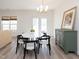A sunny dining area with white table and chairs, with access to the outdoor space at 2067 White Pond Ct, Apex, NC 27523