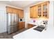 Bright kitchen with white countertops, stainless steel appliances, and wooden cabinetry at 2067 White Pond Ct, Apex, NC 27523