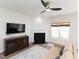 Inviting living room space with a cozy fireplace, television, and neutral decor at 2067 White Pond Ct, Apex, NC 27523