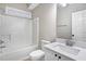 Well-lit bathroom featuring a shower-tub combo and single sink vanity at 2120 Castle Pines Dr, Raleigh, NC 27604