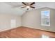 Bedroom featuring hardwood floors, natural light from a window, and a ceiling fan at 2120 Castle Pines Dr, Raleigh, NC 27604