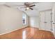 Bright bedroom features hardwood floors, natural light from a window, and a ceiling fan at 2120 Castle Pines Dr, Raleigh, NC 27604