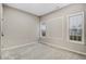 Bright bedroom features plush carpeting and a wall of windows providing ample natural light at 2120 Castle Pines Dr, Raleigh, NC 27604