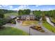 Clubhouse boasts manicured landscaping, mature trees and bushes, and adjacent golf cart storage at 2120 Castle Pines Dr, Raleigh, NC 27604