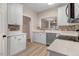 Well-lit kitchen features stainless steel appliances, ample cabinet space, and a decorative tile backsplash at 2120 Castle Pines Dr, Raleigh, NC 27604