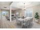 Bright living room featuring an open floor plan with modern lighting, a fireplace, and stylish décor at 2120 Castle Pines Dr, Raleigh, NC 27604