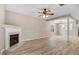 Spacious living room with fireplace and hardwood floors, offering a cozy and inviting atmosphere at 2120 Castle Pines Dr, Raleigh, NC 27604