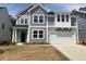 Charming two-story home with gray siding, white trim, and a two-car garage at 246 N Maple Walk Dr # 230, Garner, NC 27529