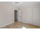 Spare bedroom with light walls, white closet, wood-look floors and natural light at 2304 Nelson St, Raleigh, NC 27610