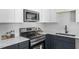 Contemporary kitchen featuring stainless steel appliances, white countertops, and ample storage at 2304 Nelson St, Raleigh, NC 27610