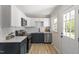 Modern kitchen featuring stainless steel appliances, sleek countertops, and ample cabinet space at 2304 Nelson St, Raleigh, NC 27610