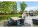 Grassy backyard features a patio with an outdoor dining table at 2326 Marlow Dr, Burlington, NC 27215