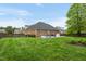 Large backyard with a hot tub and mature trees that provide lots of shade at 2326 Marlow Dr, Burlington, NC 27215