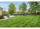 Huge backyard with a large, lush green lawn and mature shade trees at 2326 Marlow Dr, Burlington, NC 27215
