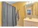 Neutral bathroom with tile accents, framed mirror, and vanity at 2326 Marlow Dr, Burlington, NC 27215