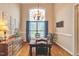 Elegant dining room featuring a large window, chandelier, and hardwood floors at 2326 Marlow Dr, Burlington, NC 27215