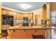 Charming kitchen featuring granite countertops, wooden cabinets, and stainless steel appliances at 2326 Marlow Dr, Burlington, NC 27215