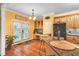 Bright kitchen featuring stainless steel appliances, granite countertops, and access to the outdoor patio at 2326 Marlow Dr, Burlington, NC 27215