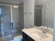Bathroom featuring sleek shower with glass door, a toilet and modern vanity with sink at 245 N Maple Walk Dr # 219, Garner, NC 27529