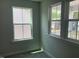Bedroom featuring a view from the windows and soft, neutral-toned carpet at 245 N Maple Walk Dr # 219, Garner, NC 27529