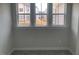 Bedroom featuring a view from the windows and soft, neutral-toned carpet at 245 N Maple Walk Dr # 219, Garner, NC 27529