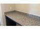 Desk nook offers a granite countertop and a dark base cabinet at 245 N Maple Walk Dr # 219, Garner, NC 27529