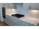 Contemporary kitchen with white cabinets, stainless steel appliances, and subway tile backsplash at 245 N Maple Walk Dr # 219, Garner, NC 27529