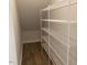 Walk-in pantry with installed wire shelving and laminate floors at 245 N Maple Walk Dr # 219, Garner, NC 27529