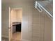 A walk-in closet with white wire shelving and a desk area with granite countertops provides plenty of storage at 245 N Maple Walk Dr # 219, Garner, NC 27529